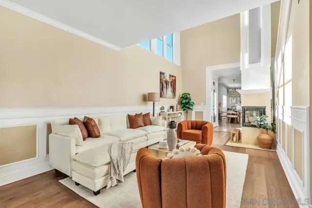 a living room with furniture and a lamp