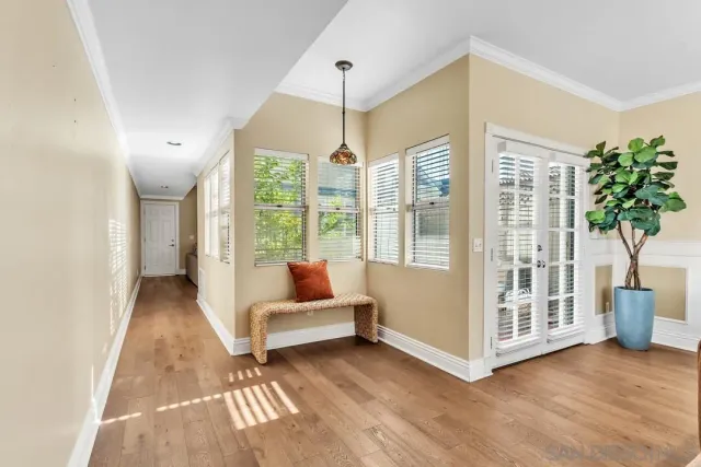 a view of a dining room with furniture chandelier and a chandelier