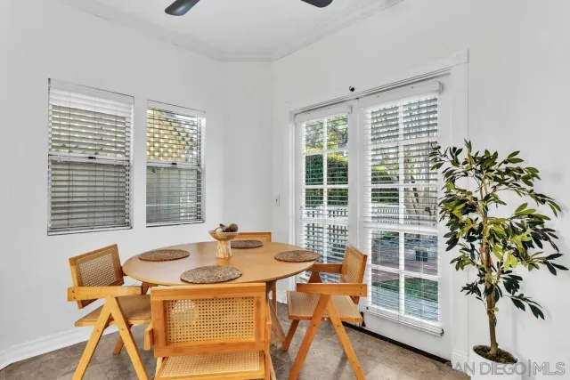 a bathroom with a bathtub shower and window
