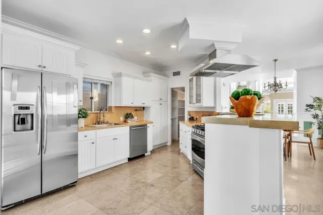 a bedroom with a bed and a potted plant