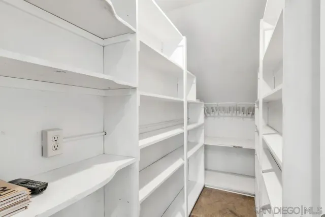 a view of room with furniture and wooden floor