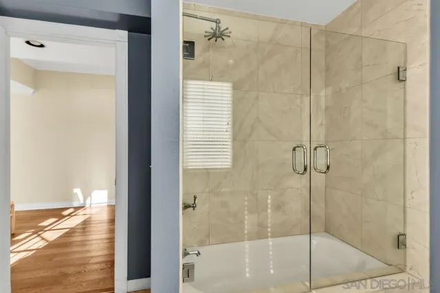 an aerial view of a city with lots of residential buildings and ocean view