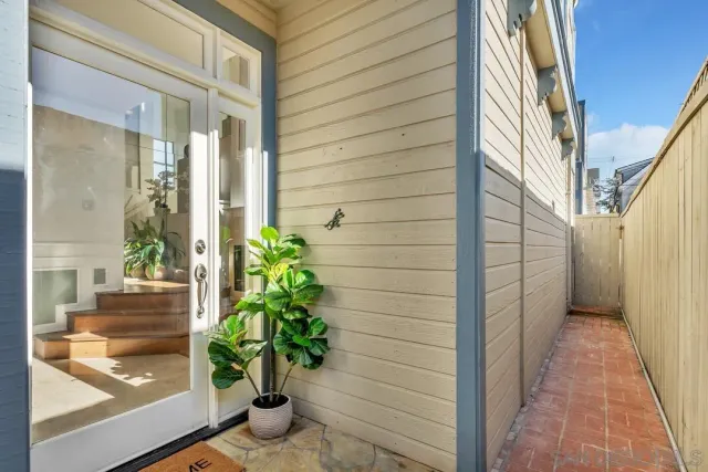 a living room with furniture fireplace and a large window