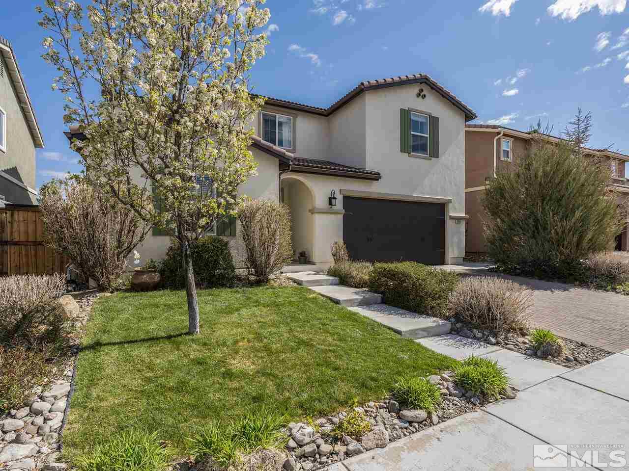2055 Peaceful Valley Drive Reno, NV 89521 - Photo 3 of 26 a front view of a house with a yard and garage