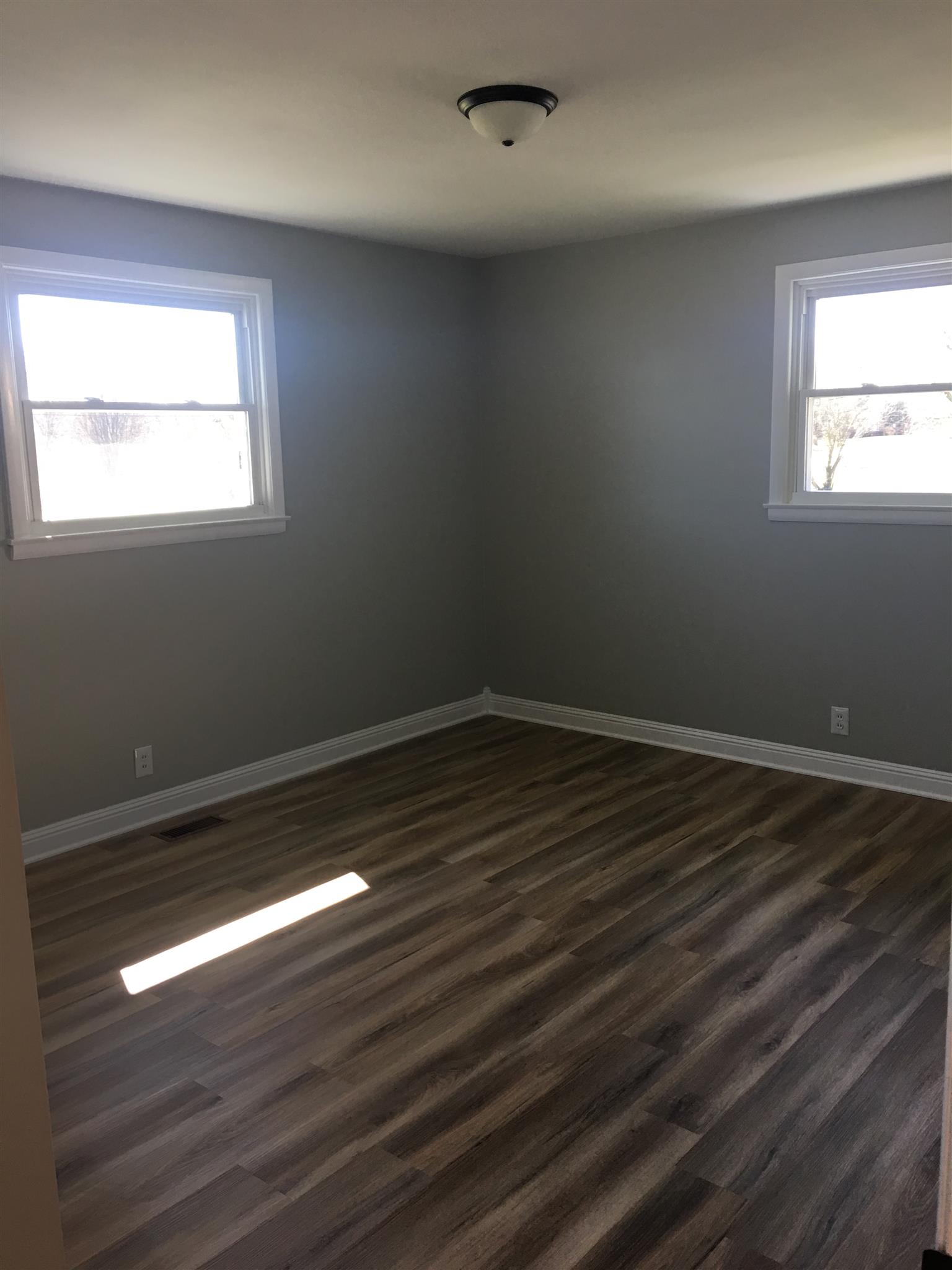 825 East Campbell Road Madison, TN 37115 - Photo 11 of 20 Master Bedroom 13x12 Freshly painted and NEW laminate flooring