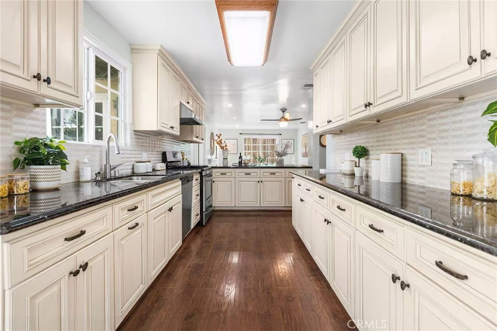 511 Dalesford Drive La Puente, CA 91744 - Photo 12 of 37 a large kitchen with stainless steel appliances lots of counter space and wooden floor