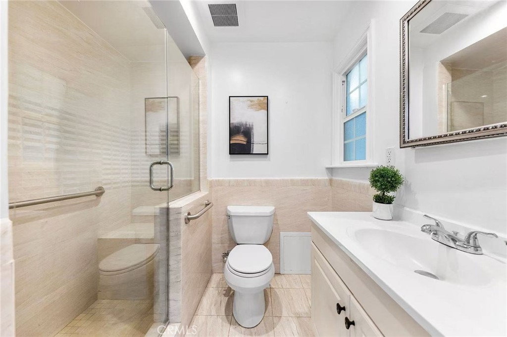 511 Dalesford Drive La Puente, CA 91744 - Photo 17 of 37 a bathroom with a toilet sink and mirror