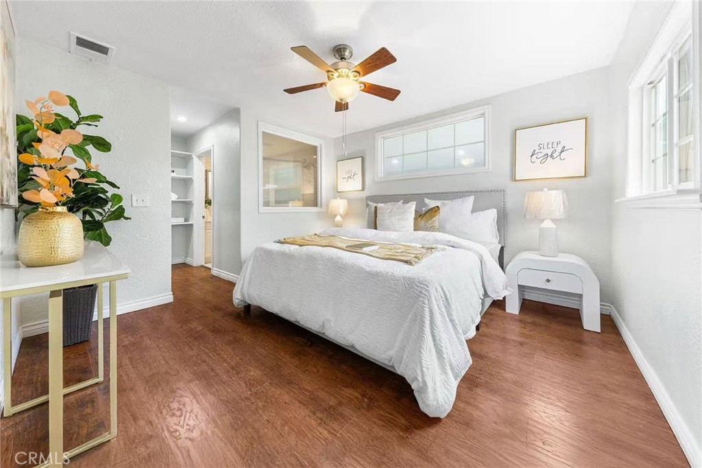 511 Dalesford Drive La Puente, CA 91744 - Photo 18 of 37 a bedroom with a bed and a chandelier