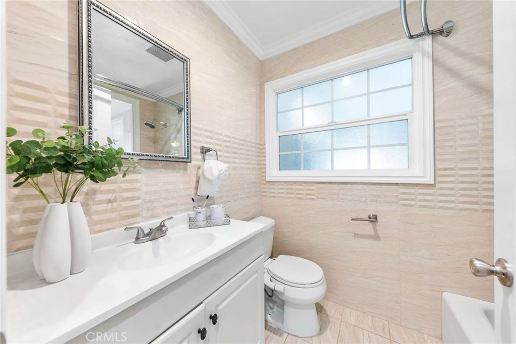 511 Dalesford Drive La Puente, CA 91744 - Photo 19 of 37 a bathroom with a sink a mirror and a toilet