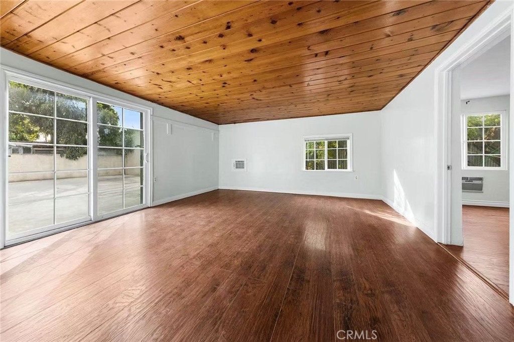 511 Dalesford Drive La Puente, CA 91744 - Photo 21 of 37 a view of an empty room with wooden floor and a window