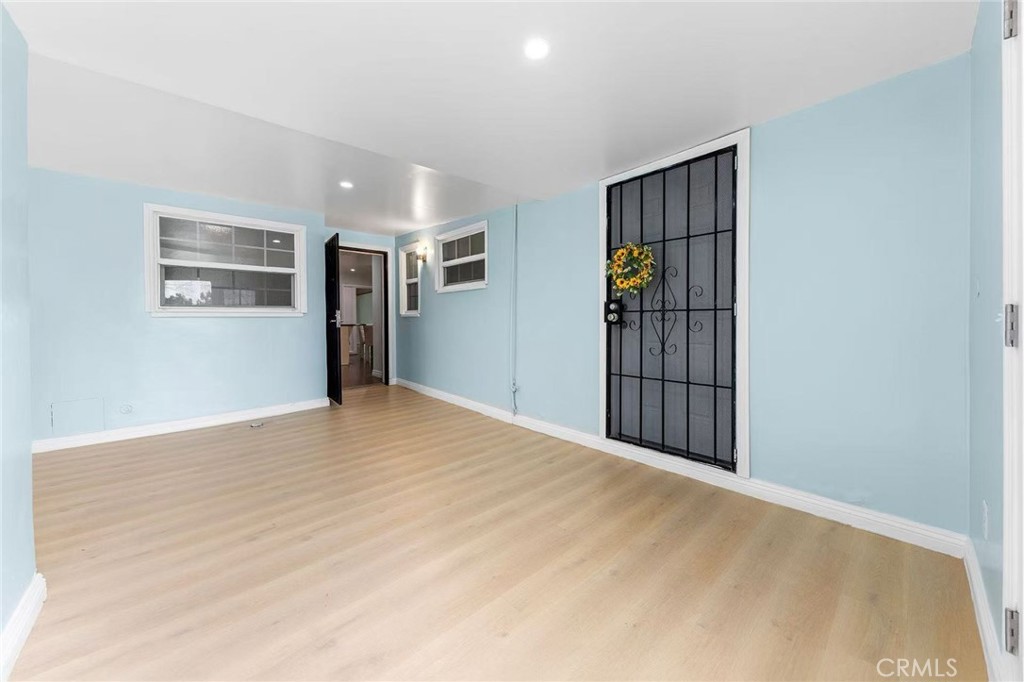 511 Dalesford Drive La Puente, CA 91744 - Photo 24 of 37 a view of empty room with wooden floor and window