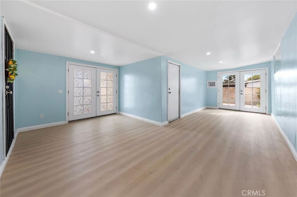 511 Dalesford Drive La Puente, CA 91744 - Photo 25 of 37 a view of an empty room with a window and wooden floor