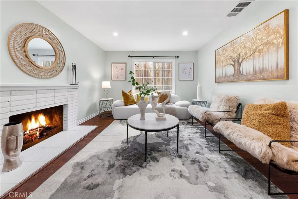 511 Dalesford Drive La Puente, CA 91744 - Photo 6 of 37 a living room with furniture a window and a fireplace