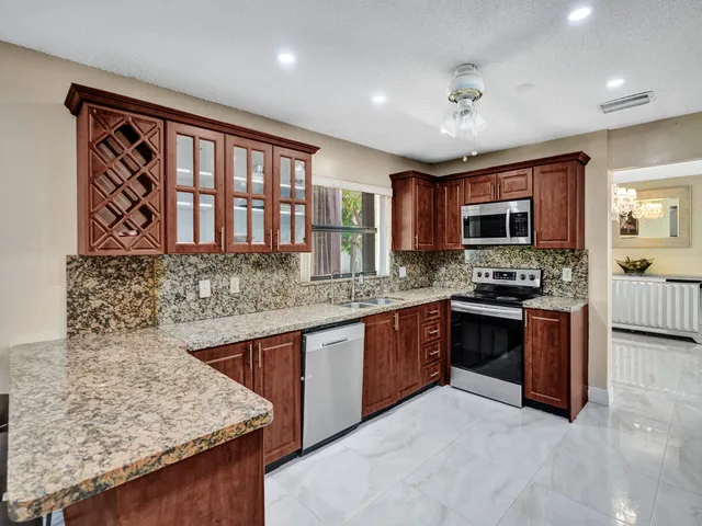 an aerial view of a house with a yard and outdoor seating