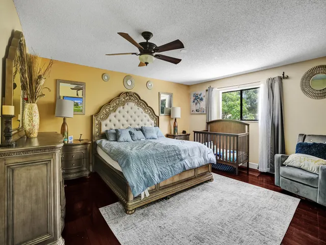 a bathroom with a double vanity sink toilet mirror and shower