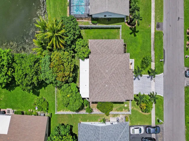 a bathroom with a sink vanity granite and a mirror
