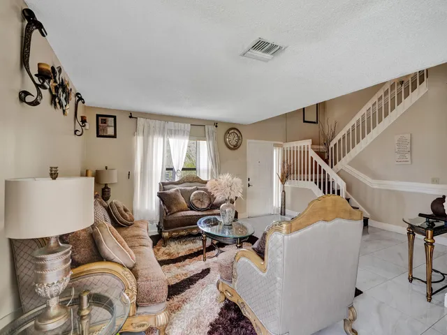 a bathroom with a toilet sink vanity and mirror