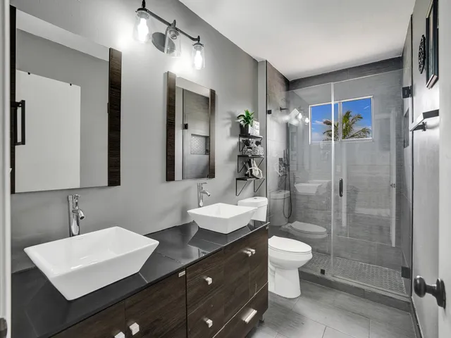 a front view of a house with a yard and a garage