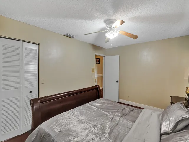 a view of a lake with houses in the back