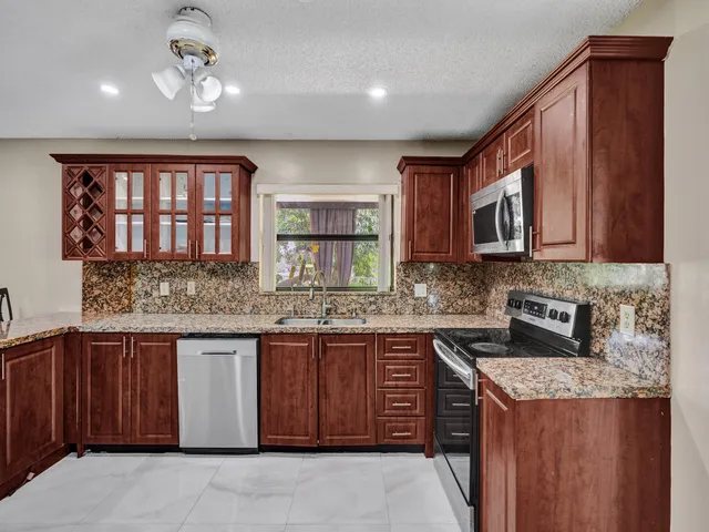 a front view of a house with a yard and porch
