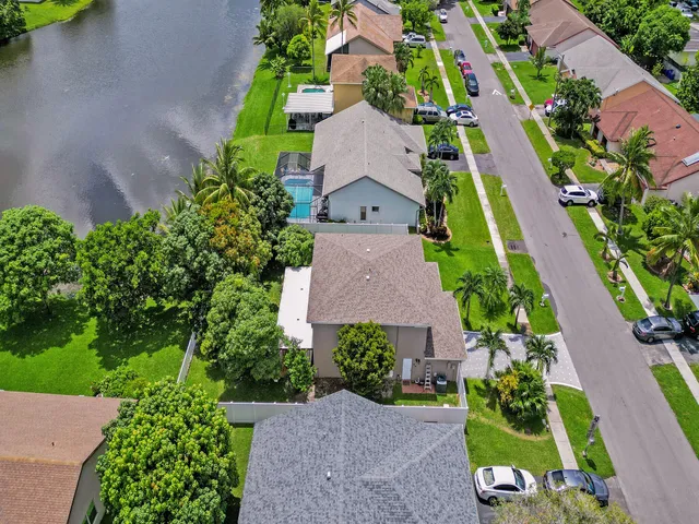 an aerial view of a house with a garden