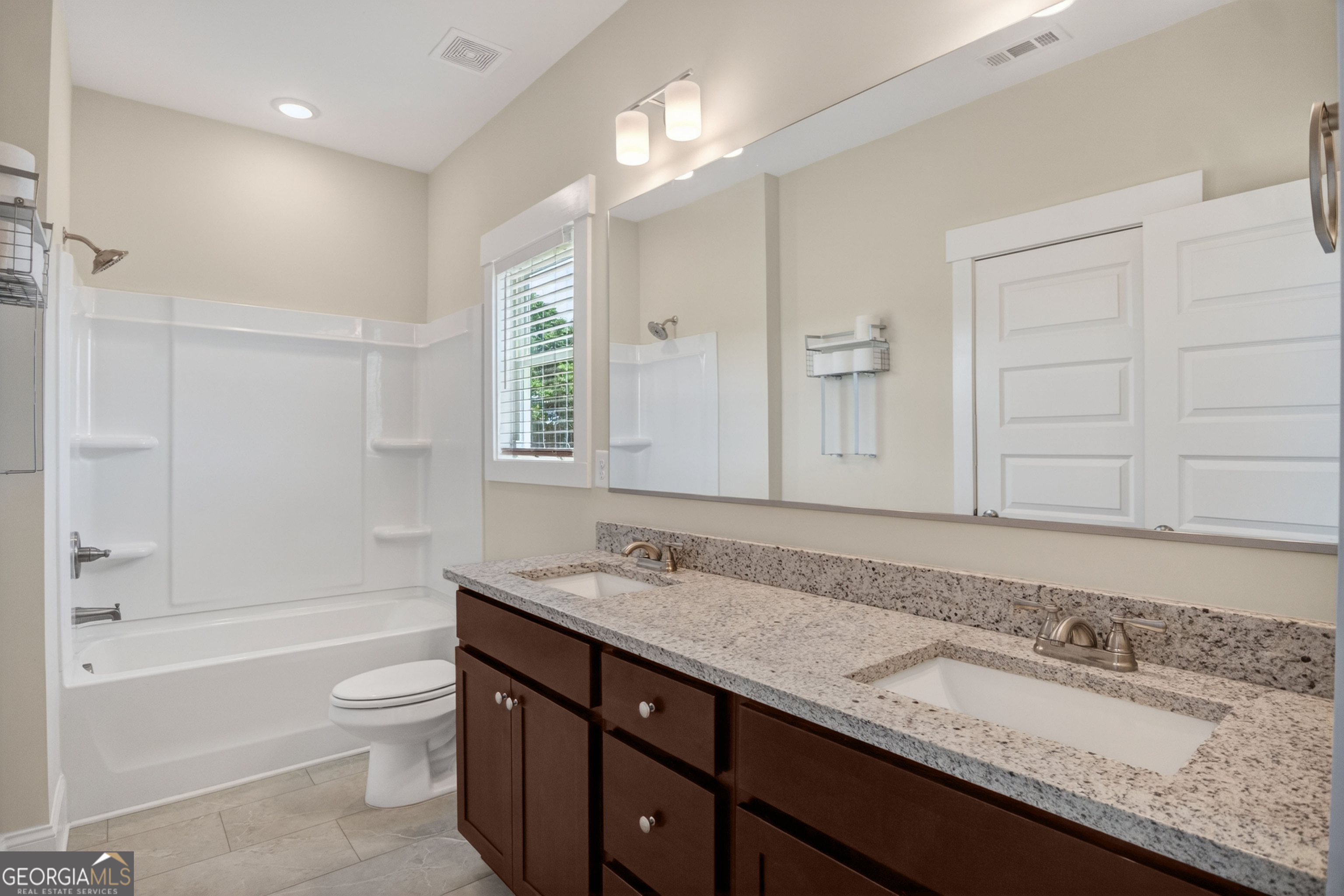 1350-c O Draper Road Comer, GA 30629 - Photo 22 of 47 a bathroom with a granite countertop double vanity sink a mirror and a bathtub