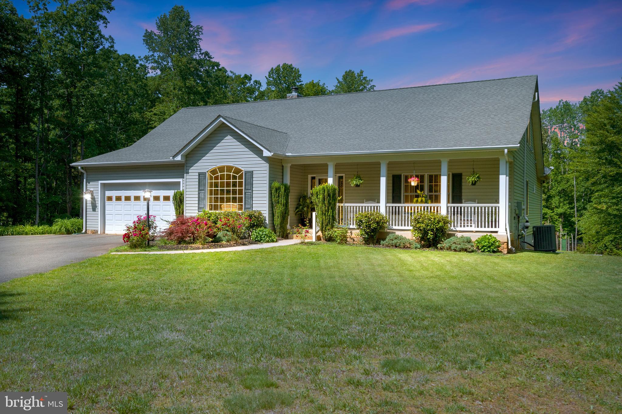 28229 Beech Drive Rhoadesville, VA 22542 - Photo 1 of 62 a front view of a house with a yard