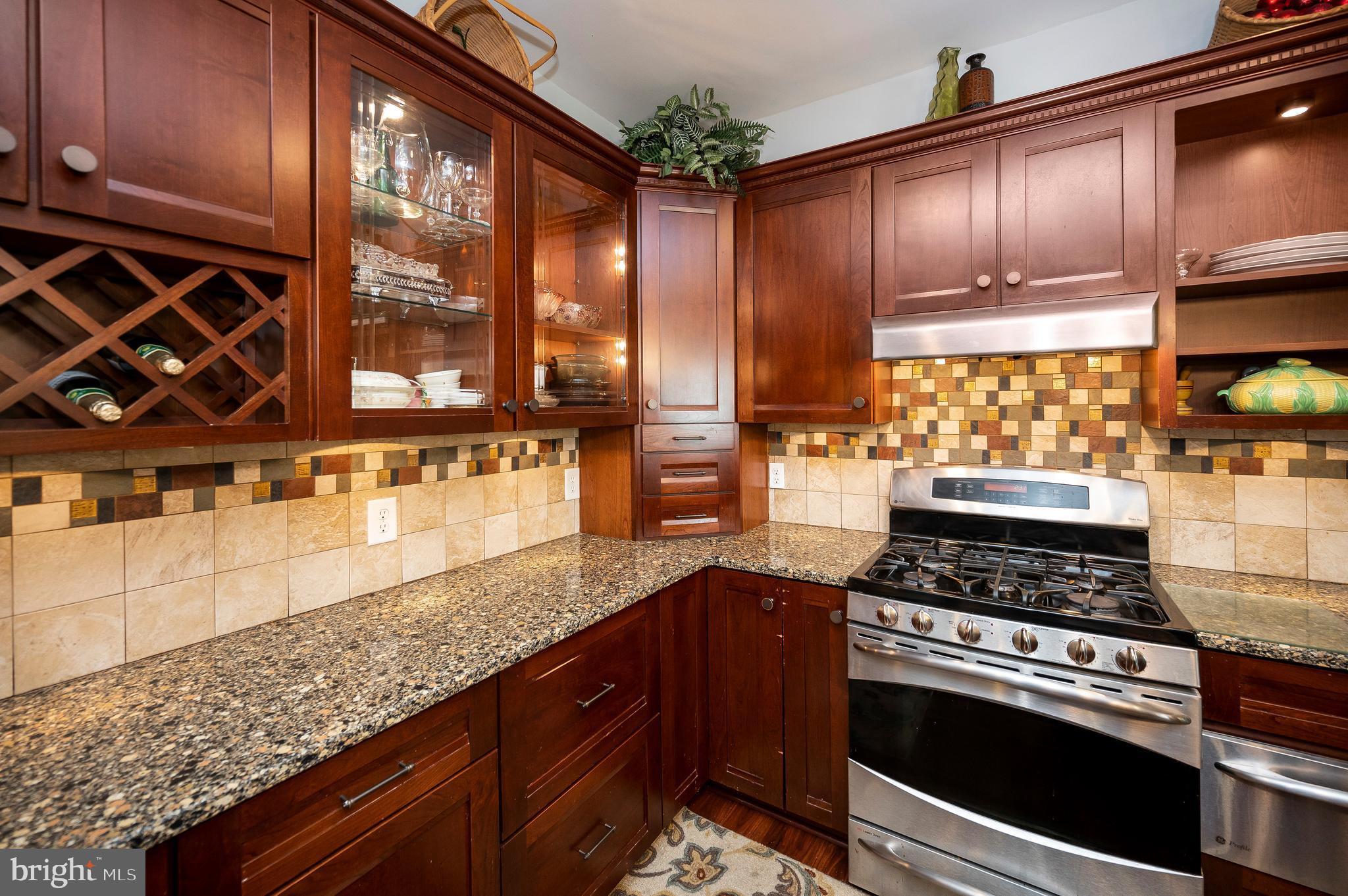 28229 Beech Drive Rhoadesville, VA 22542 - Photo 11 of 62 a kitchen with stainless steel appliances granite countertop a stove a sink and cabinets