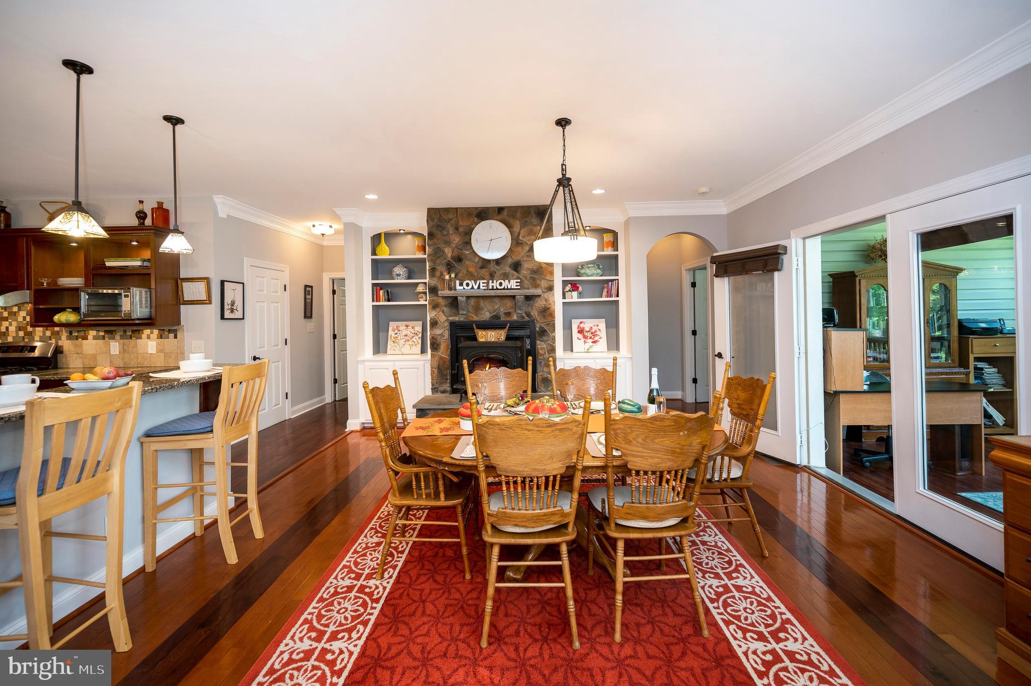28229 Beech Drive Rhoadesville, VA 22542 - Photo 14 of 62 a view of a dining room with furniture window and wooden floor