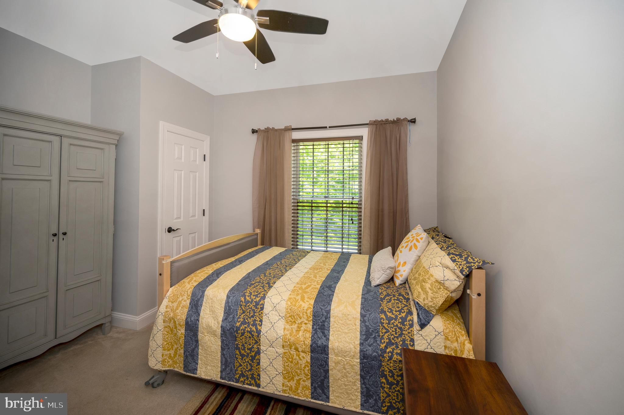28229 Beech Drive Rhoadesville, VA 22542 - Photo 19 of 62 a bed sitting in a bedroom next to a window