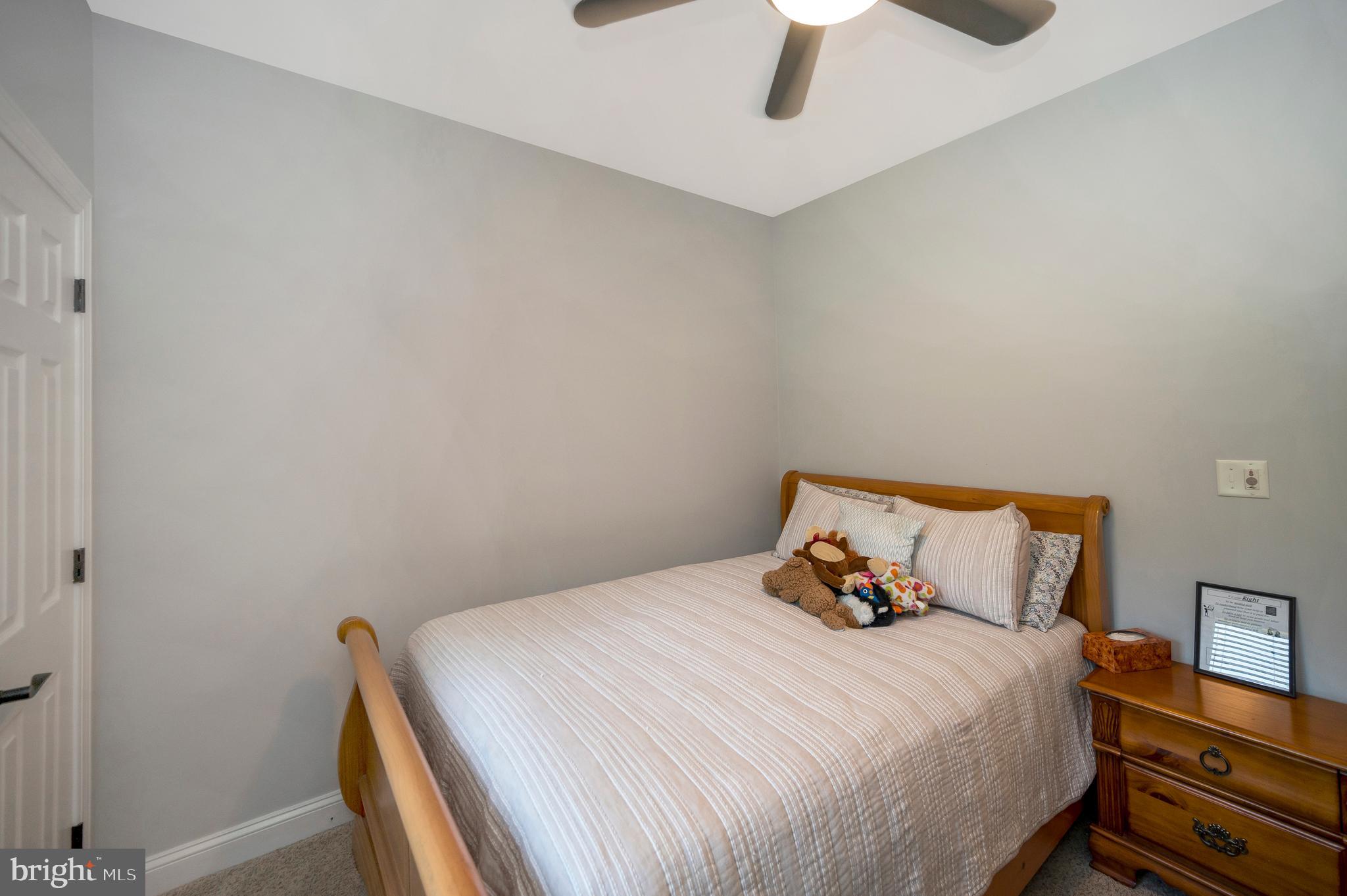 28229 Beech Drive Rhoadesville, VA 22542 - Photo 21 of 62 a bedroom with a bed and a ceiling fan