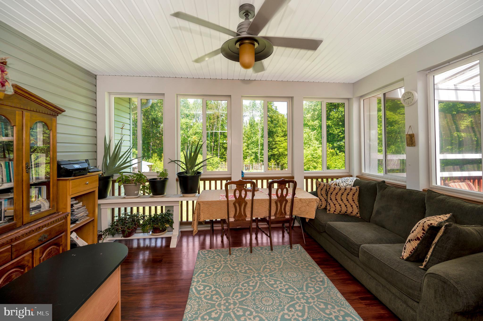 28229 Beech Drive Rhoadesville, VA 22542 - Photo 22 of 62 a living room with furniture and a large window