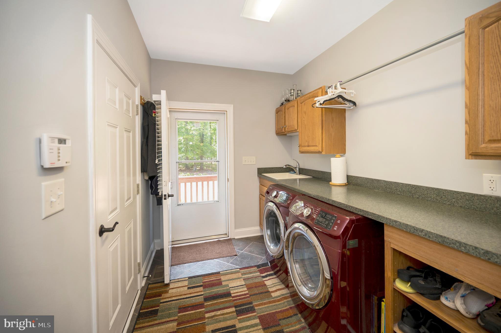 28229 Beech Drive Rhoadesville, VA 22542 - Photo 27 of 62 a utility room with dryer and washer