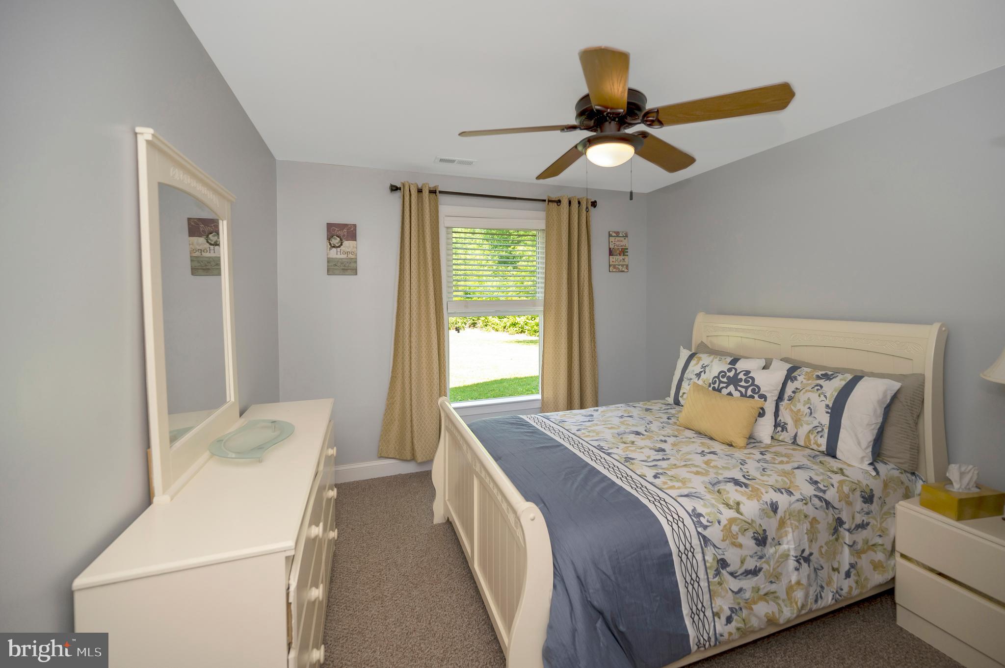 28229 Beech Drive Rhoadesville, VA 22542 - Photo 40 of 62 a bedroom with a bed and a chandelier