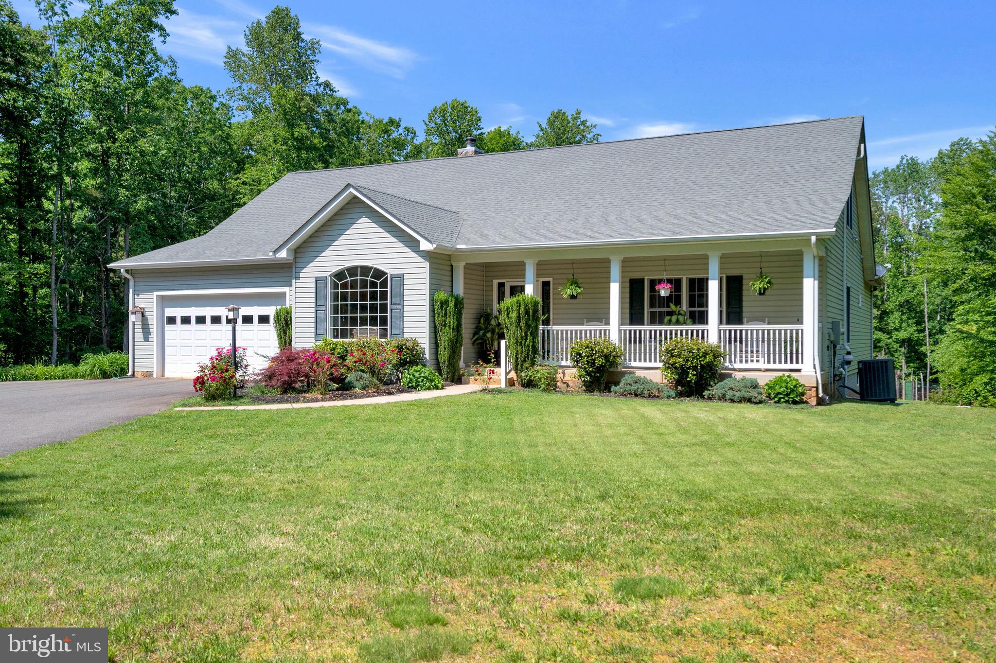 28229 Beech Drive Rhoadesville, VA 22542 - Photo 46 of 62 a front view of a house with a yard and porch