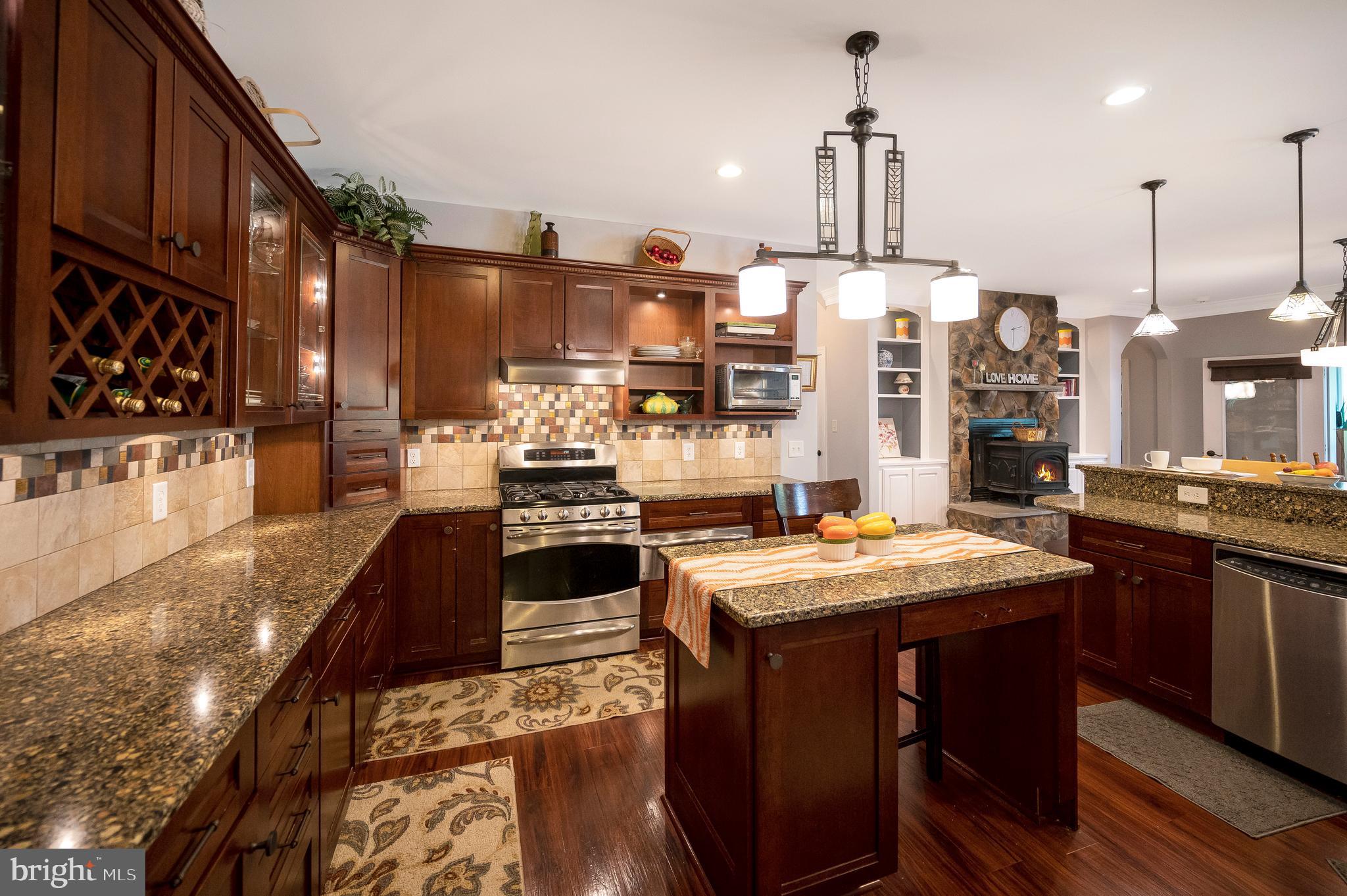 28229 Beech Drive Rhoadesville, VA 22542 - Photo 7 of 62 a kitchen with stainless steel appliances granite countertop a sink stove and refrigerator
