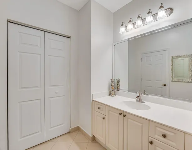 a bathroom with a sink double vanity and shower curtain