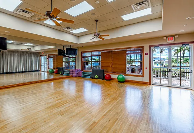 a living room with furniture a book shelf and a book shelf