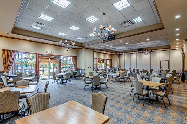 a room with furniture and pool table