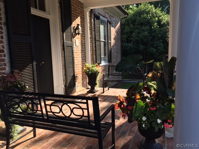 2328 Stormont Road Saluda, VA 23149 - Photo 28 of 49 Lovely covered front porch has views of boxwood ga