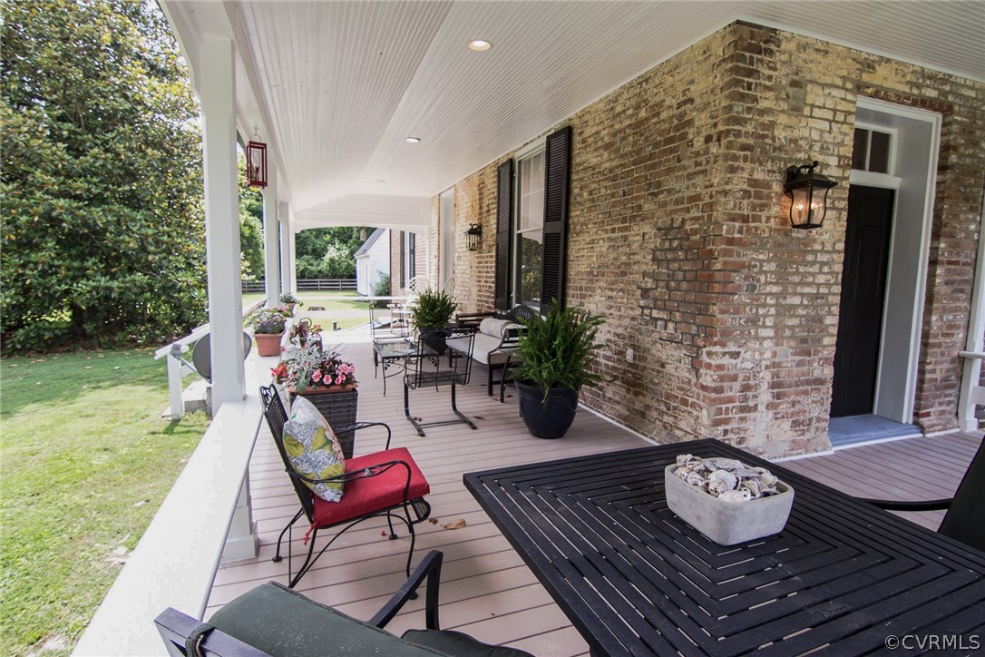 2328 Stormont Road Saluda, VA 23149 - Photo 43 of 49 Large wrap-a-round rear porch shows off Flemish Bo