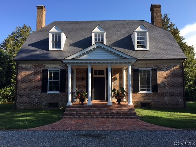 Beautiful Flemish bond brick and slate home has a