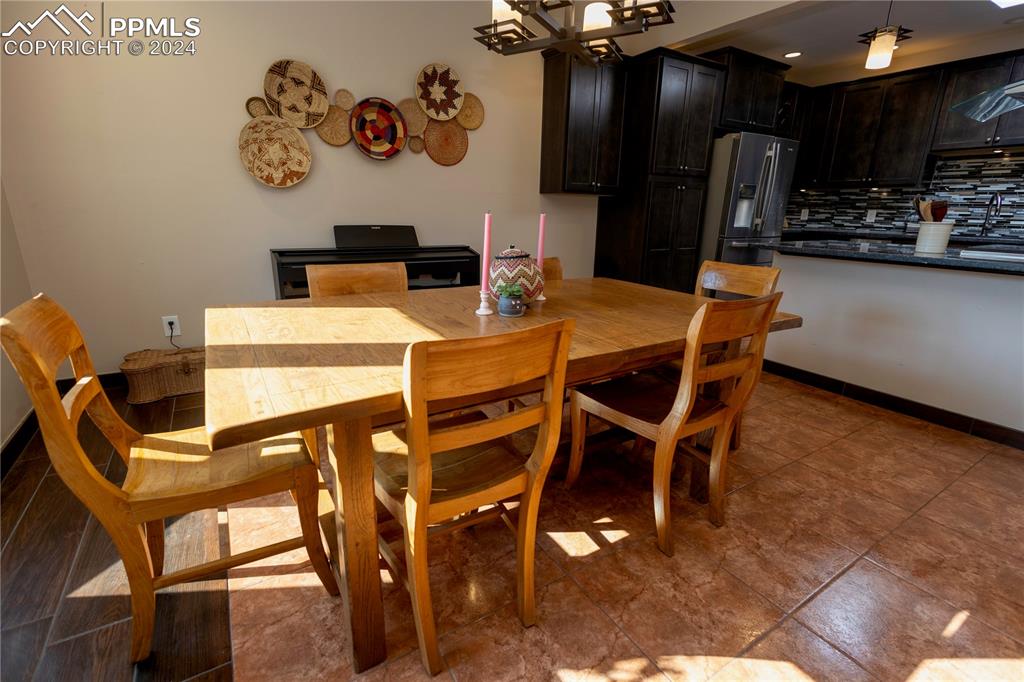 3123 Broadmoor Valley Road, Unit D Colorado Springs, CO 80906 - Photo 14 of 38 a view of a dining room with furniture
