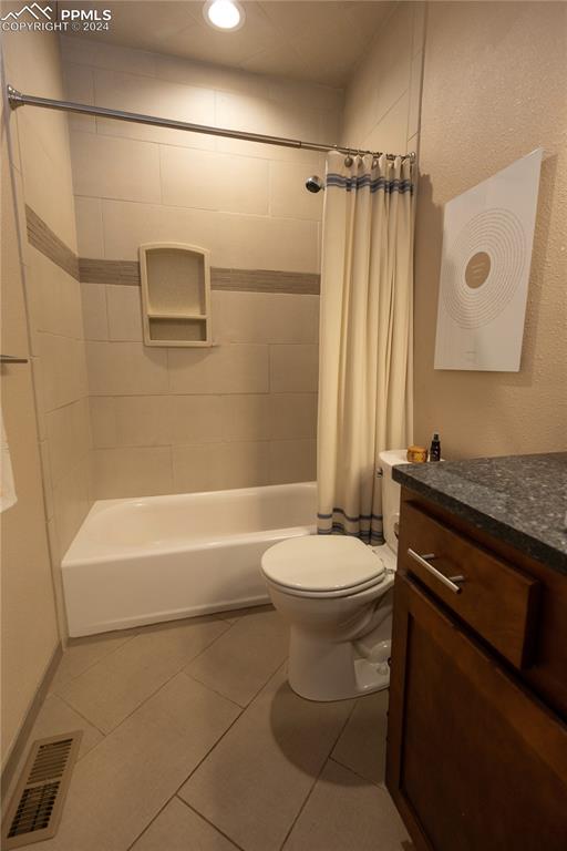 3123 Broadmoor Valley Road, Unit D Colorado Springs, CO 80906 - Photo 17 of 38 a bathroom with a sink a toilet and shower