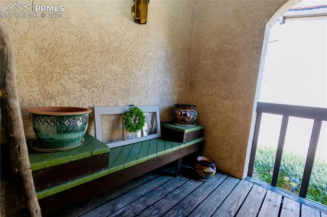 a view of balcony with wooden floor