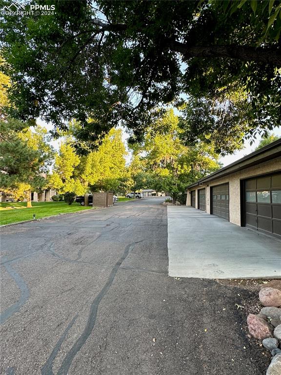 3123 Broadmoor Valley Road, Unit D Colorado Springs, CO 80906 - Photo 33 of 38 a view of a house with a tree