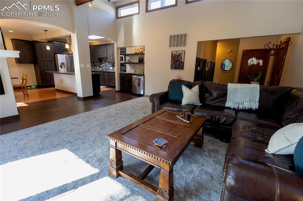 3123 Broadmoor Valley Road, Unit D Colorado Springs, CO 80906 - Photo 4 of 38 a living room with furniture and wooden floor