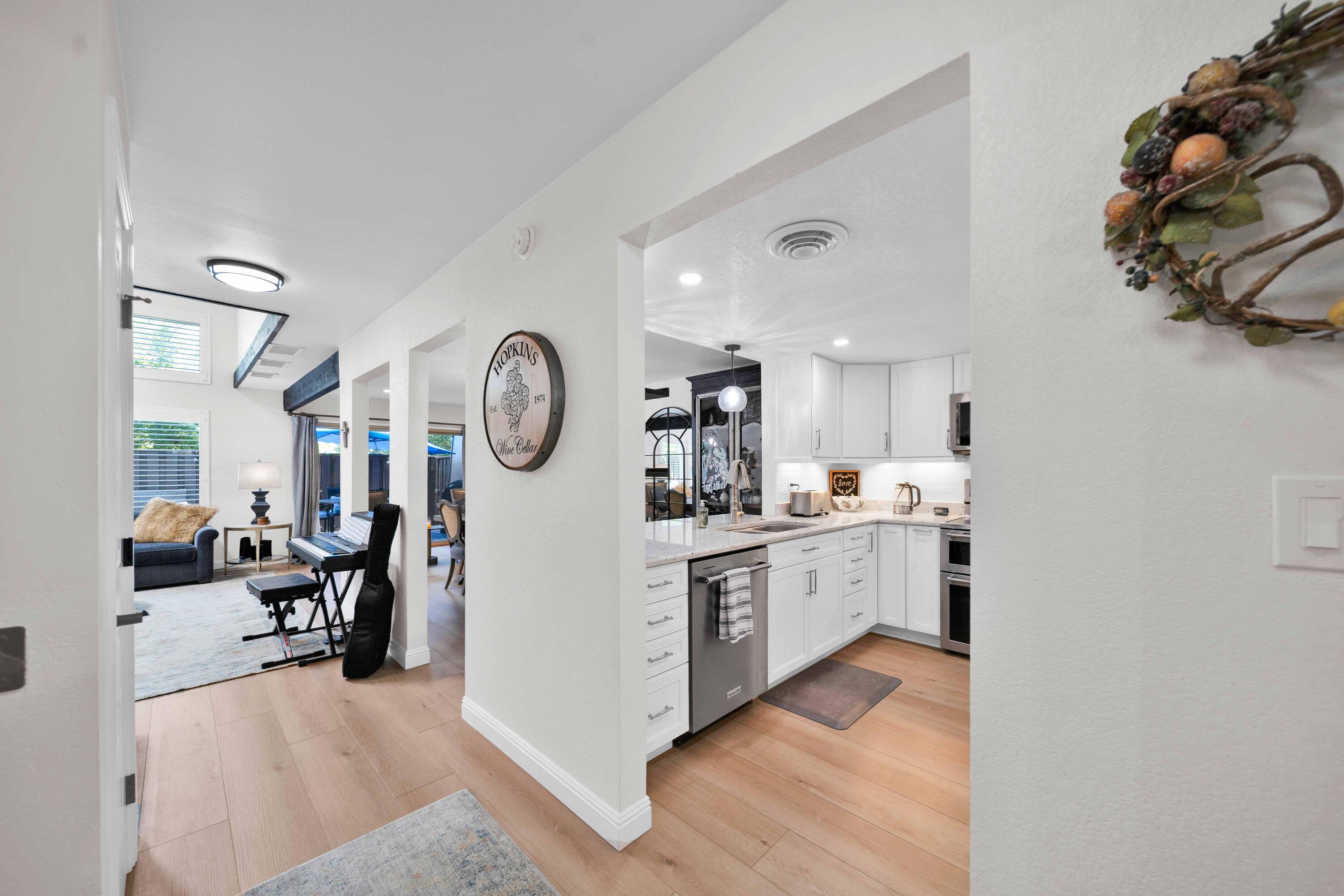 1928 Bechelli Lane Redding, CA 96002 - Photo 14 of 67 a large white kitchen with cabinets