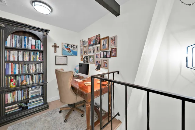 a spacious bathroom with a tub sink and mirror