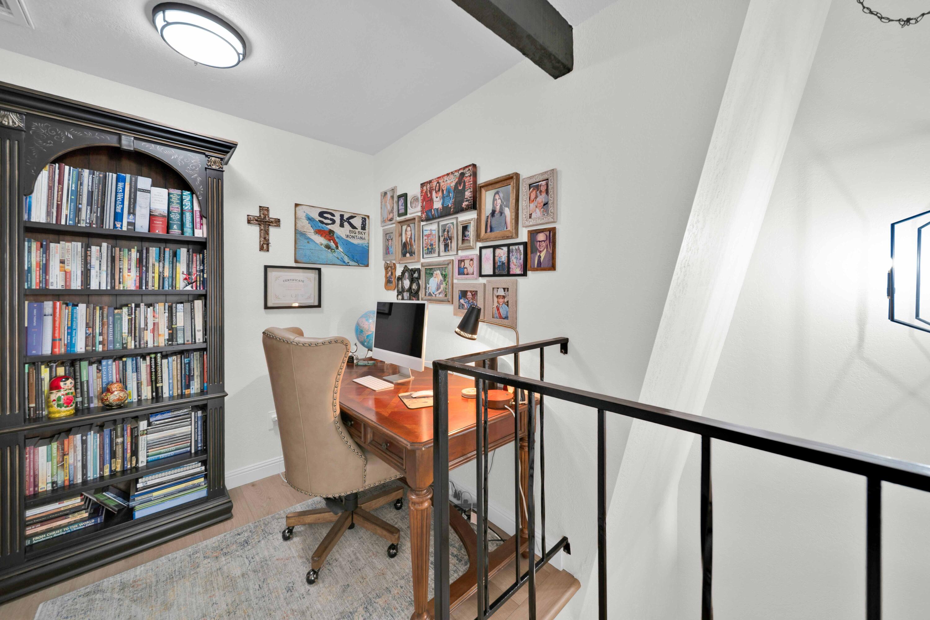 1928 Bechelli Lane Redding, CA 96002 - Photo 24 of 67 a view of a workspace with furniture and a book shelf